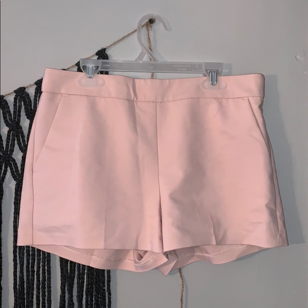 Pink Express shorts with zip on the side.
